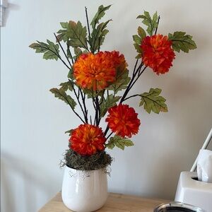 Vibrant Orange Floral Arrangement in White Vase